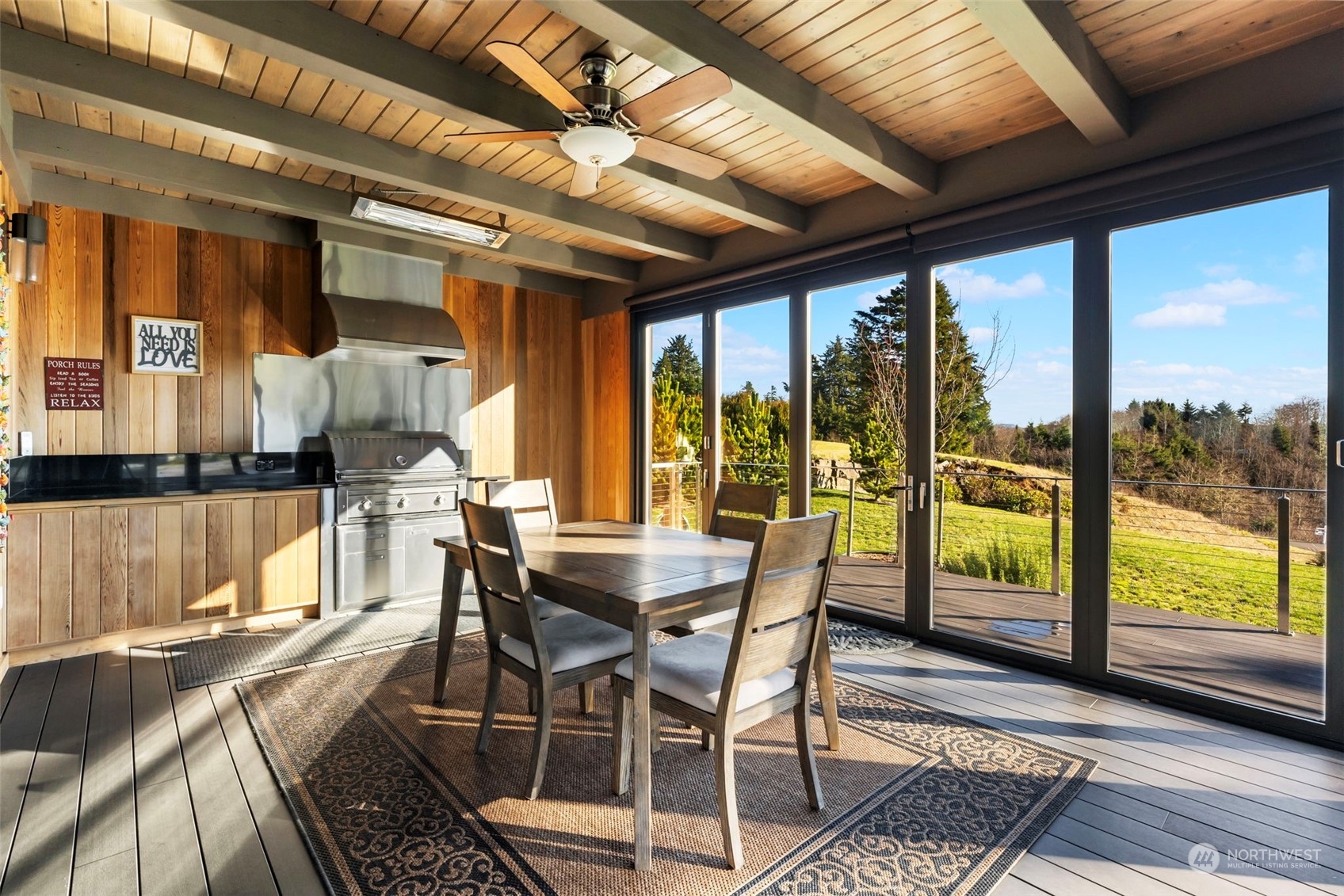 3010 Lighthouse Keepers Road Ilwaco, WA 98624 - Photo 12 of 38 a dining room with wooden floor glass table and chairs