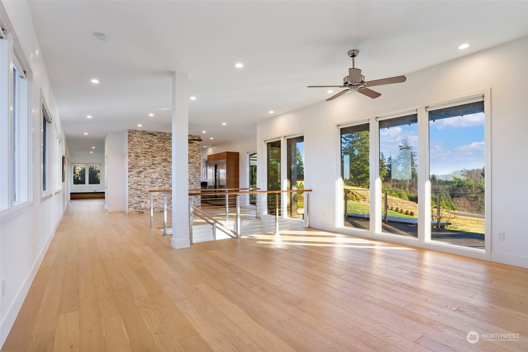 3010 Lighthouse Keepers Road Ilwaco, WA 98624 - Photo 15 of 38 an empty room with wooden floor and windows