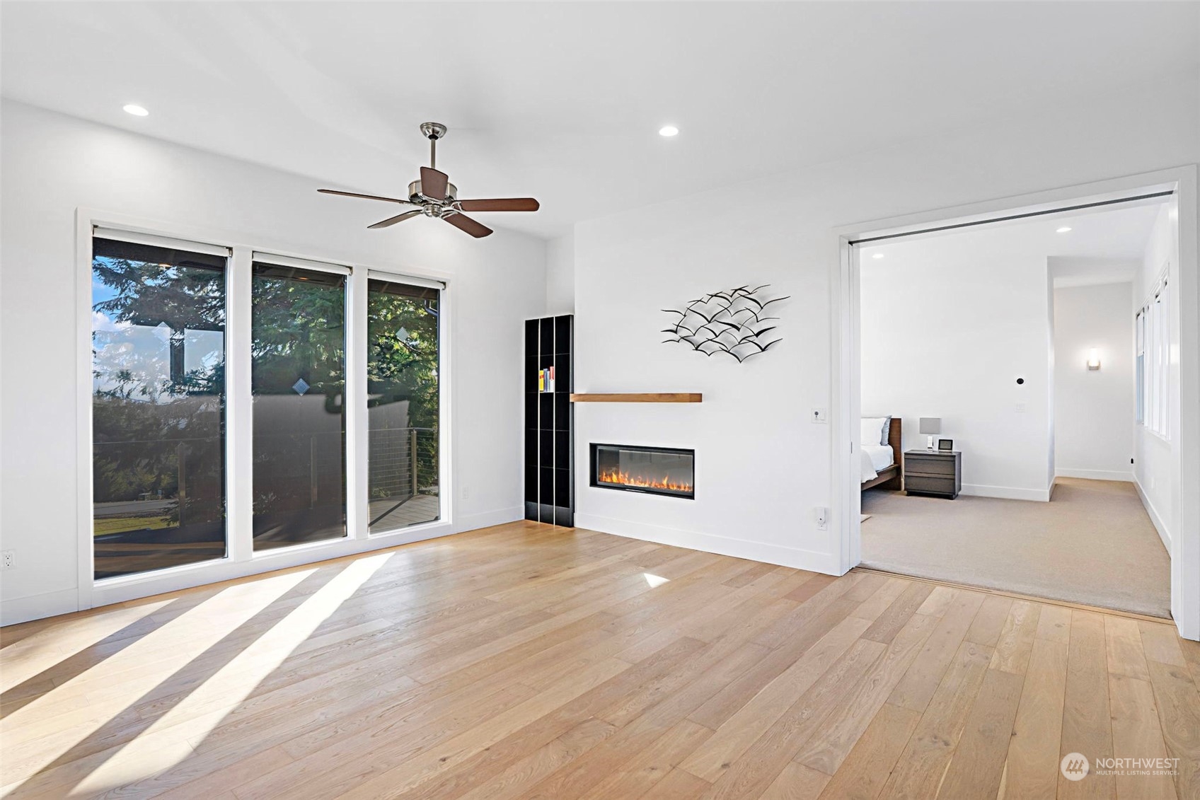 3010 Lighthouse Keepers Road Ilwaco, WA 98624 - Photo 17 of 38 a view of a livingroom with a chandelier fan and windows