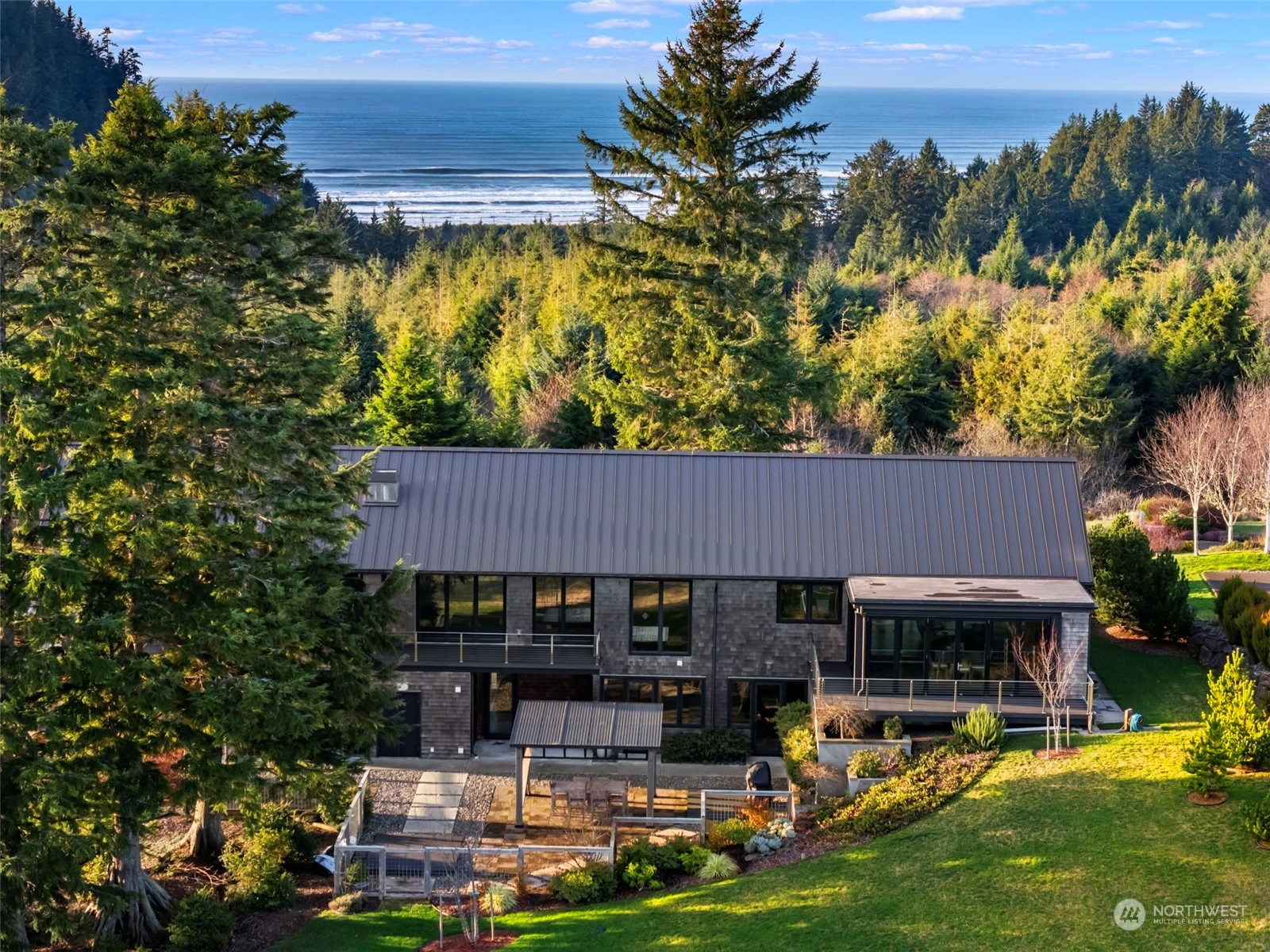 3010 Lighthouse Keepers Road Ilwaco, WA 98624 - Photo 2 of 38 an aerial view of a house with swimming pool garden and patio