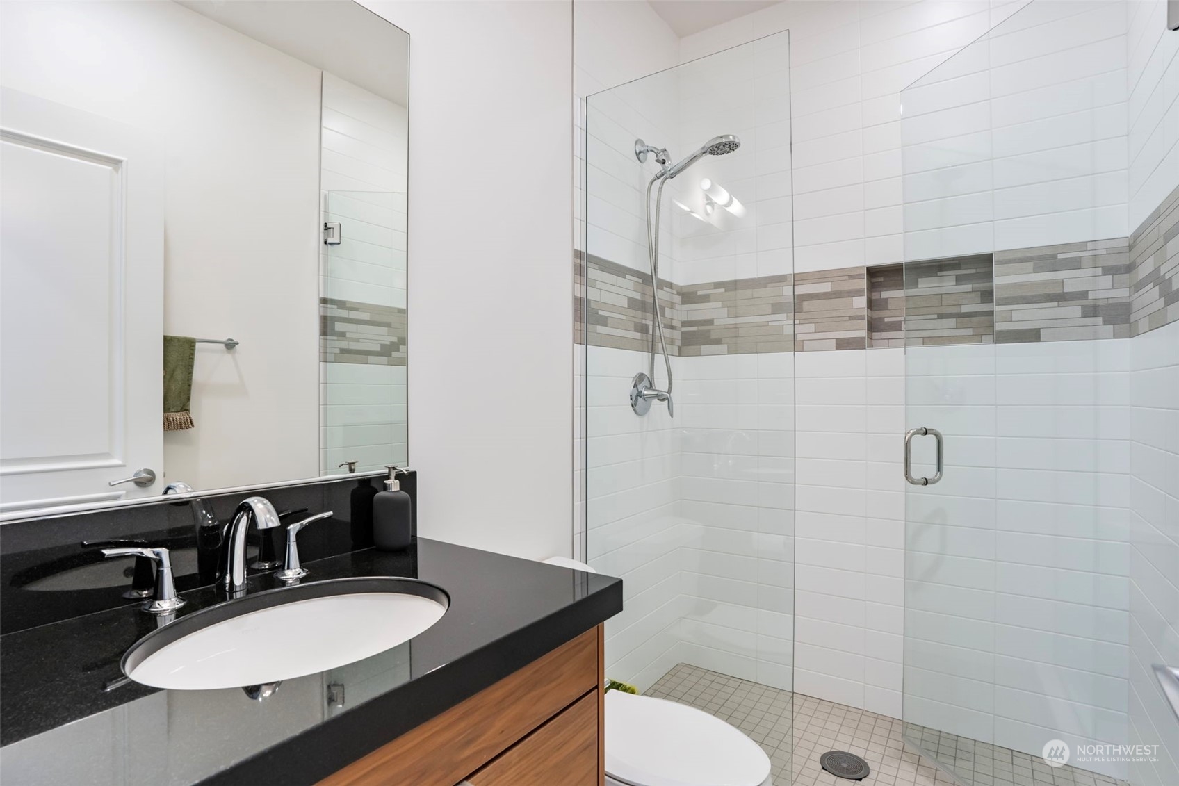 3010 Lighthouse Keepers Road Ilwaco, WA 98624 - Photo 26 of 38 a bathroom with a sink a toilet a mirror and shower