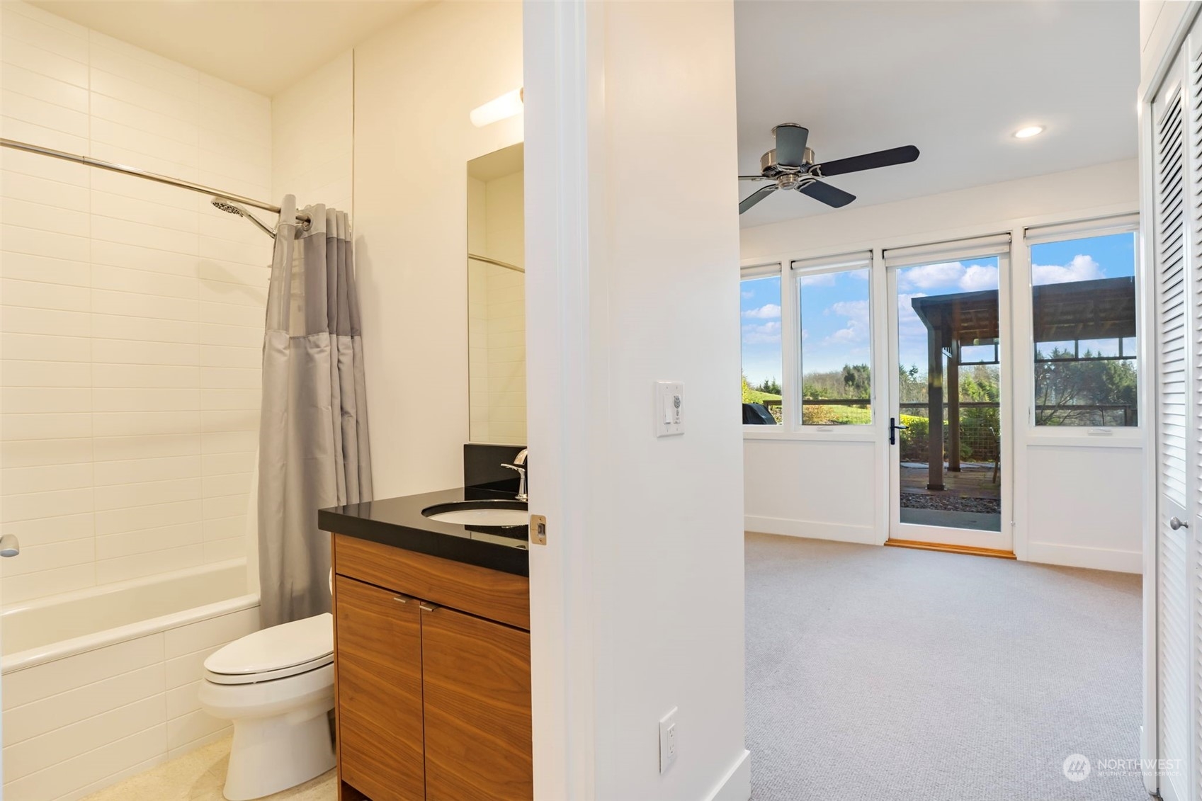 3010 Lighthouse Keepers Road Ilwaco, WA 98624 - Photo 28 of 38 a bathroom with a granite countertop sink toilet and shower