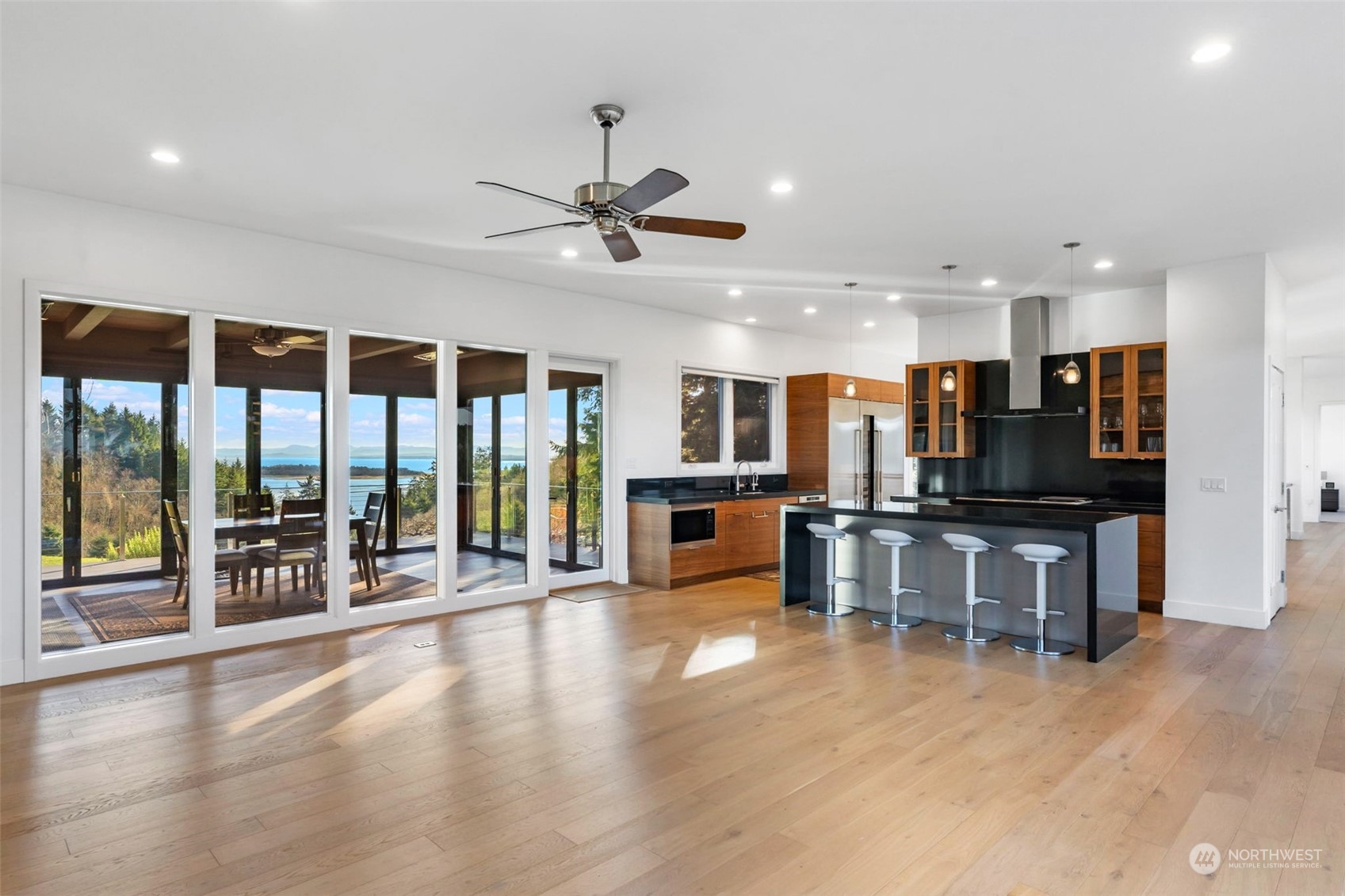 3010 Lighthouse Keepers Road Ilwaco, WA 98624 - Photo 6 of 38 a view of a living room kitchen with stainless steel appliances wooden floor and large window