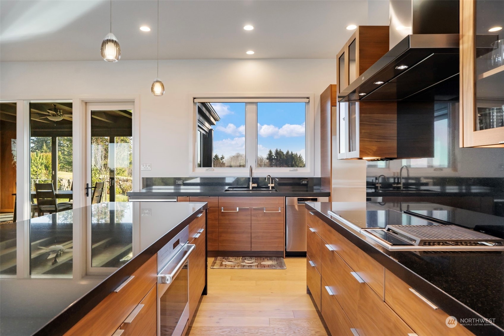 3010 Lighthouse Keepers Road Ilwaco, WA 98624 - Photo 7 of 38 a kitchen with stainless steel appliances granite countertop sink stove and cabinets
