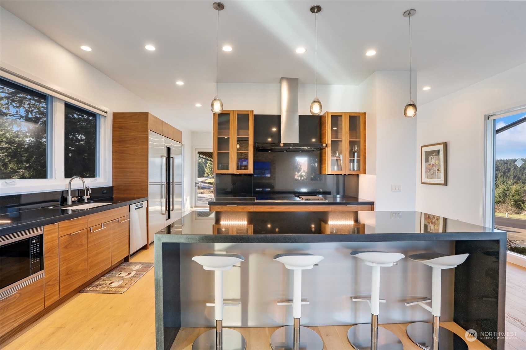 3010 Lighthouse Keepers Road Ilwaco, WA 98624 - Photo 8 of 38 a kitchen with kitchen island granite countertop a sink and counter space