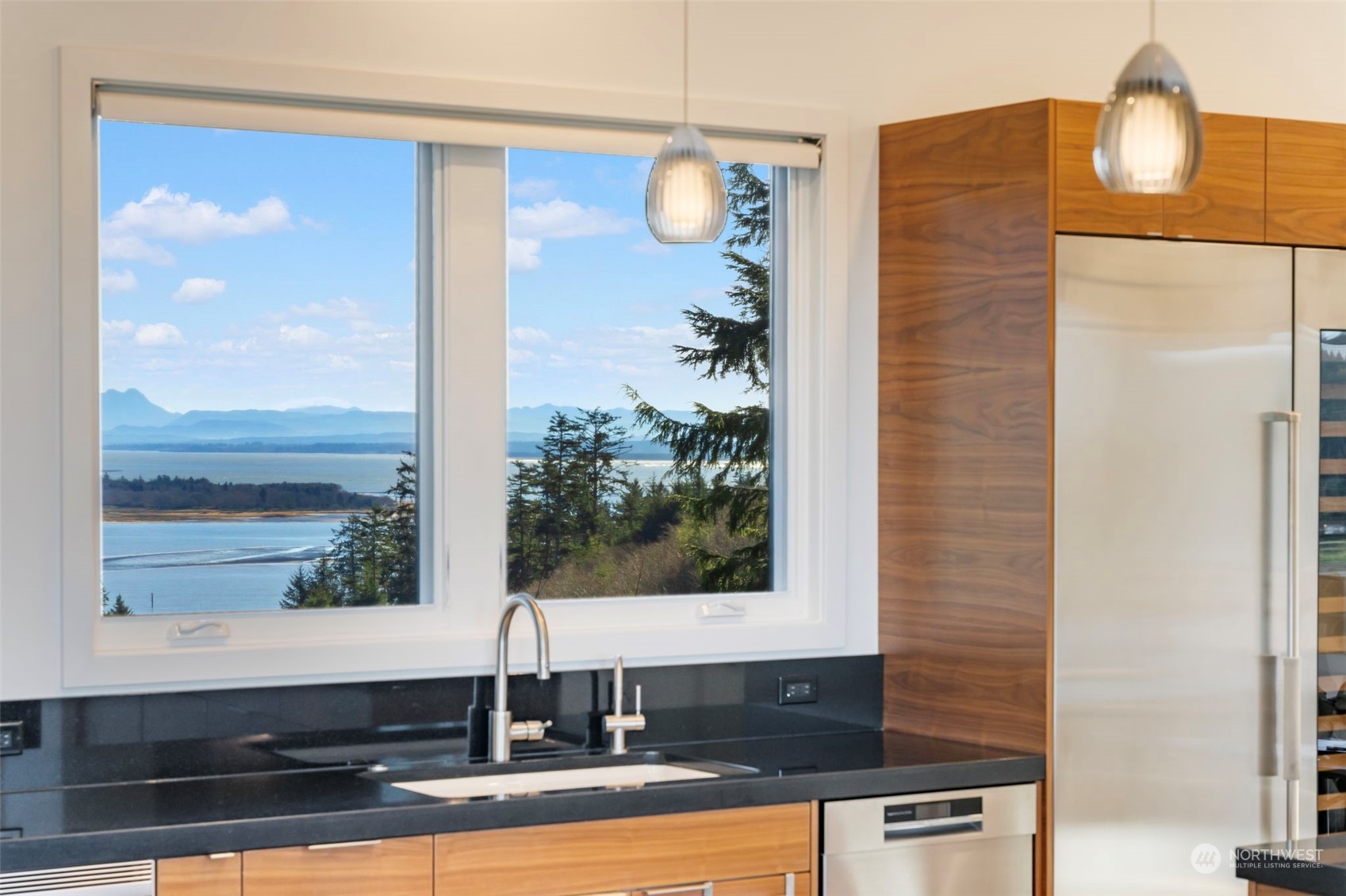 3010 Lighthouse Keepers Road Ilwaco, WA 98624 - Photo 9 of 38 a bathroom with a mirror and a sink