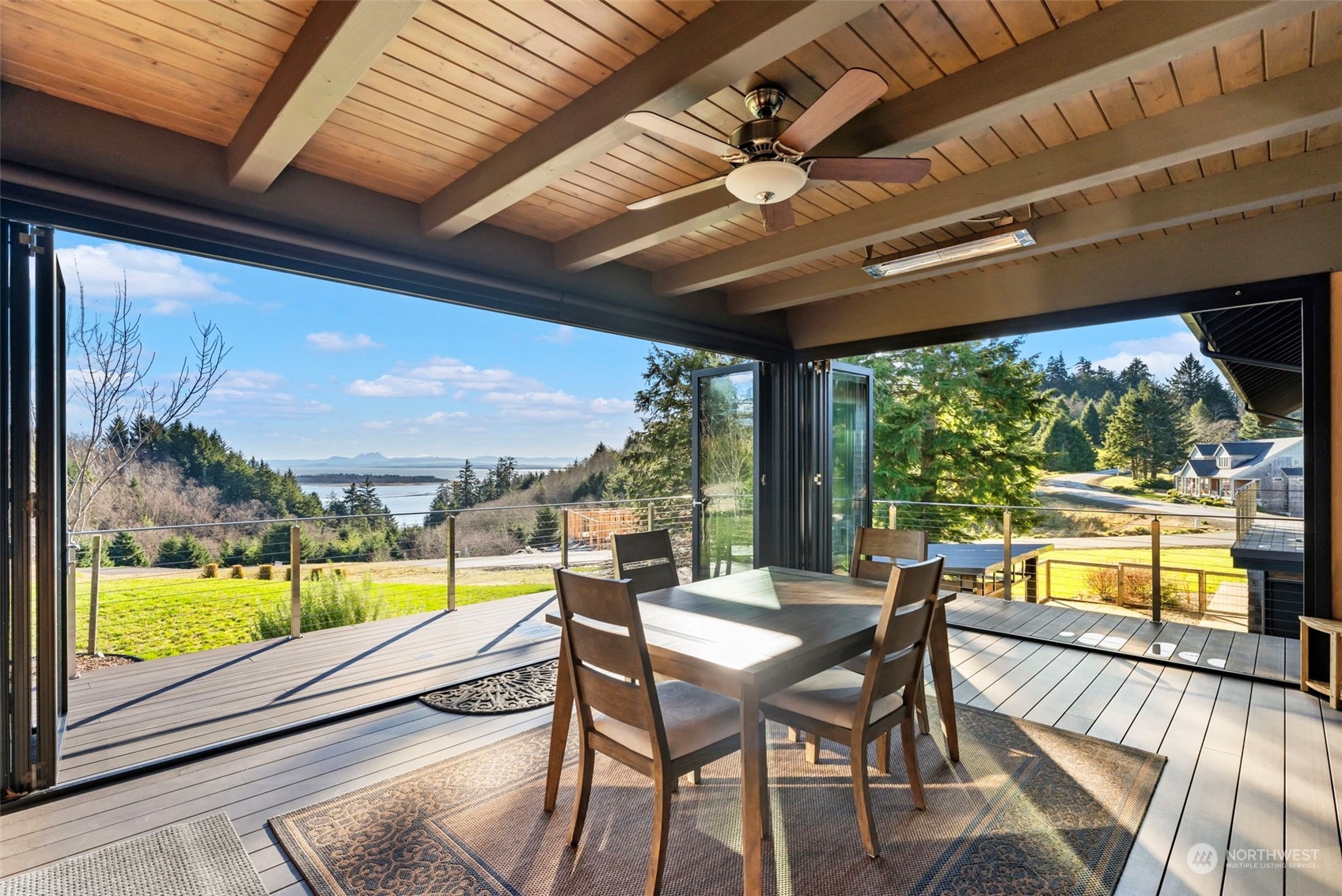 3010 Lighthouse Keepers Road Ilwaco, WA 98624 - Photo 10 of 38 a view of a porch with furniture and wooden floor