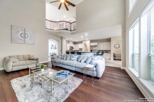 a living room with furniture or couch and a chandelier