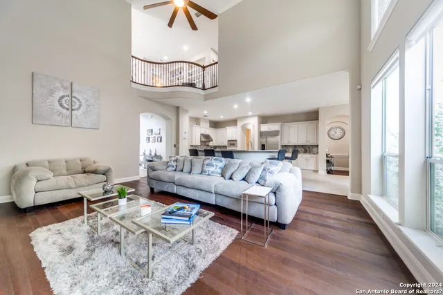 a living room with furniture or couch and a chandelier