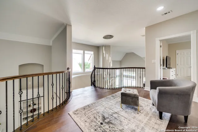 a bedroom with furniture and a window