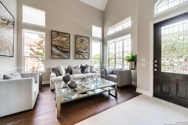 a living room with furniture and a large window