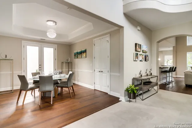 a view of a dining room with furniture and wooden floor