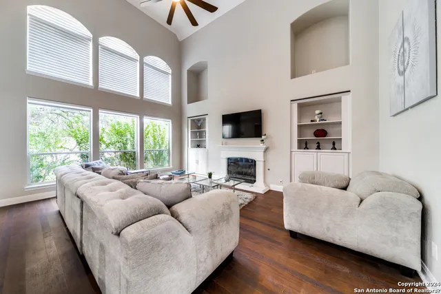 a living room with furniture and a fireplace