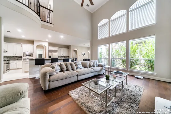 a living room with furniture and a large window