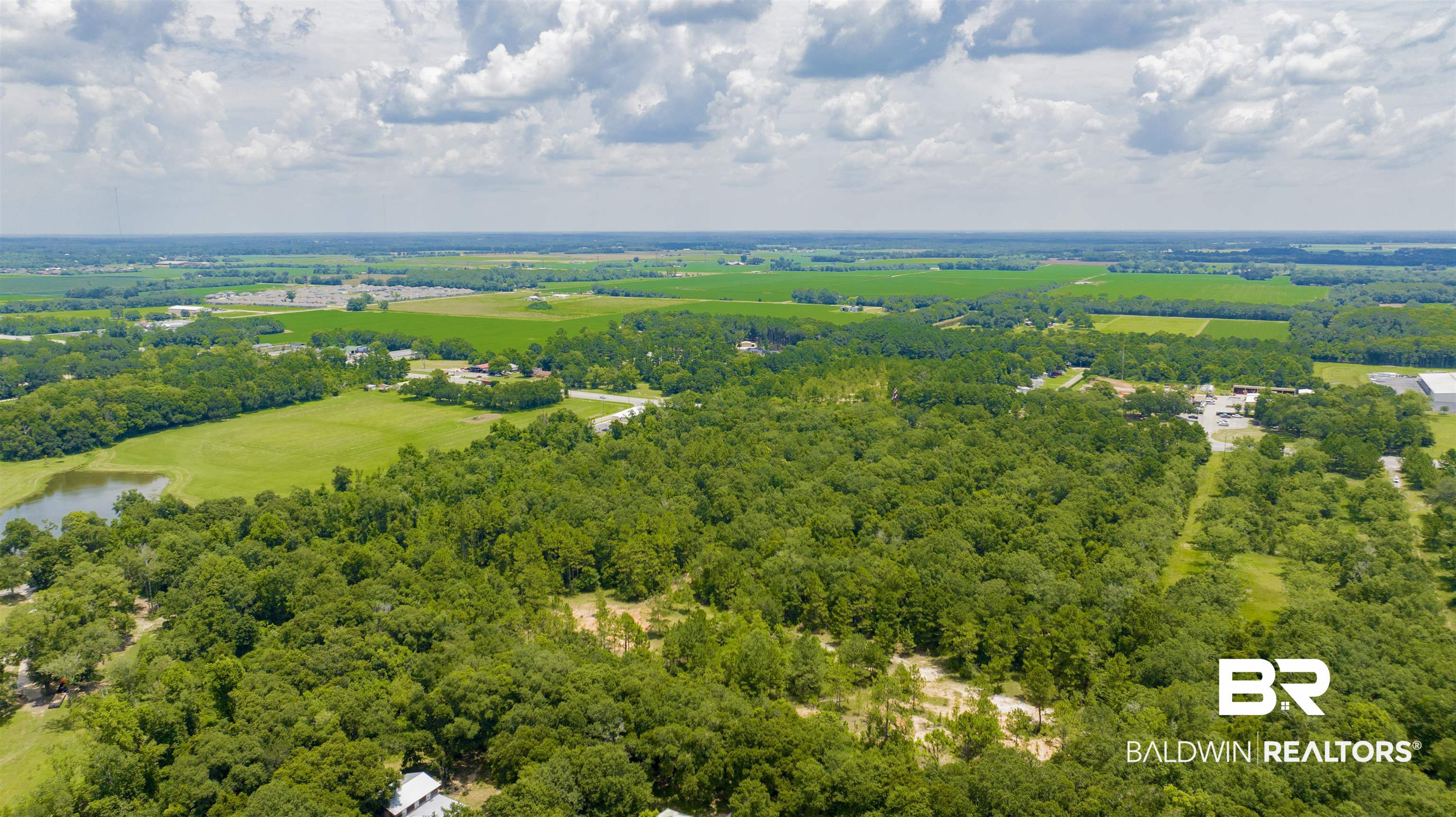 0 Vaughn Road Summerdale, AL 36580 - Photo 9 of 9 Drone / aerial view of a forest and a large body of water