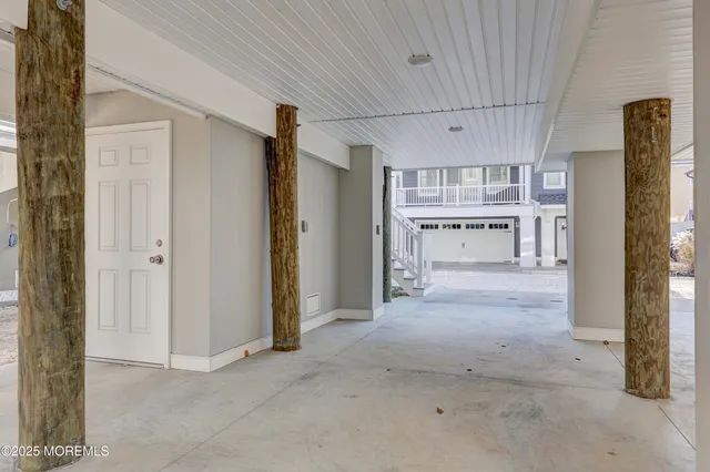 a view of a kitchen with refrigerator and a sink