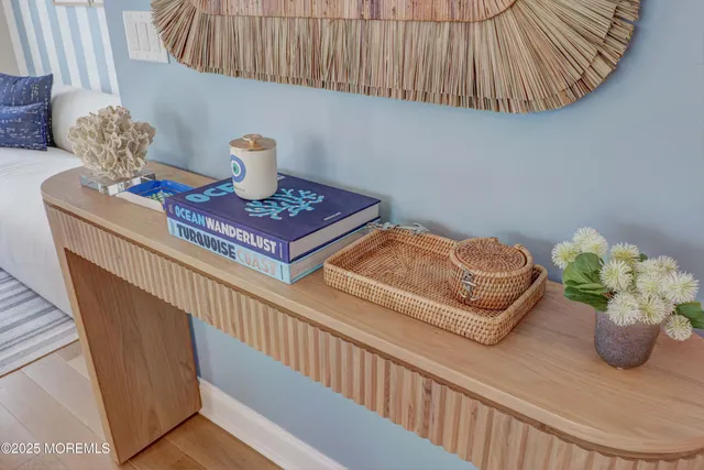 a view of a hallway with furniture
