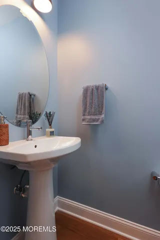 a bathroom with a sink and mirror