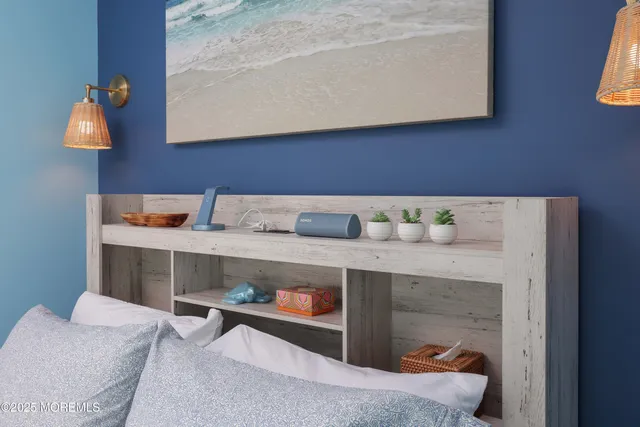 a room with a table chairs and a wooden floor