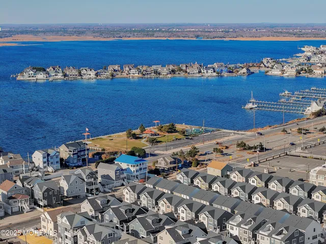 an aerial view of residential houses and outdoor space