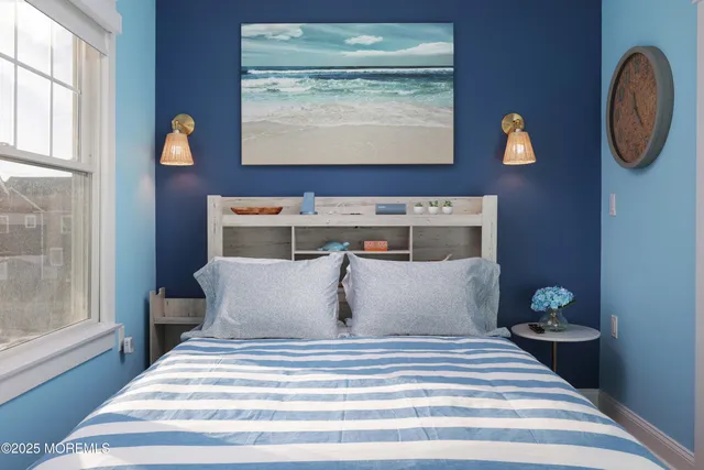 a bedroom with bed and a window