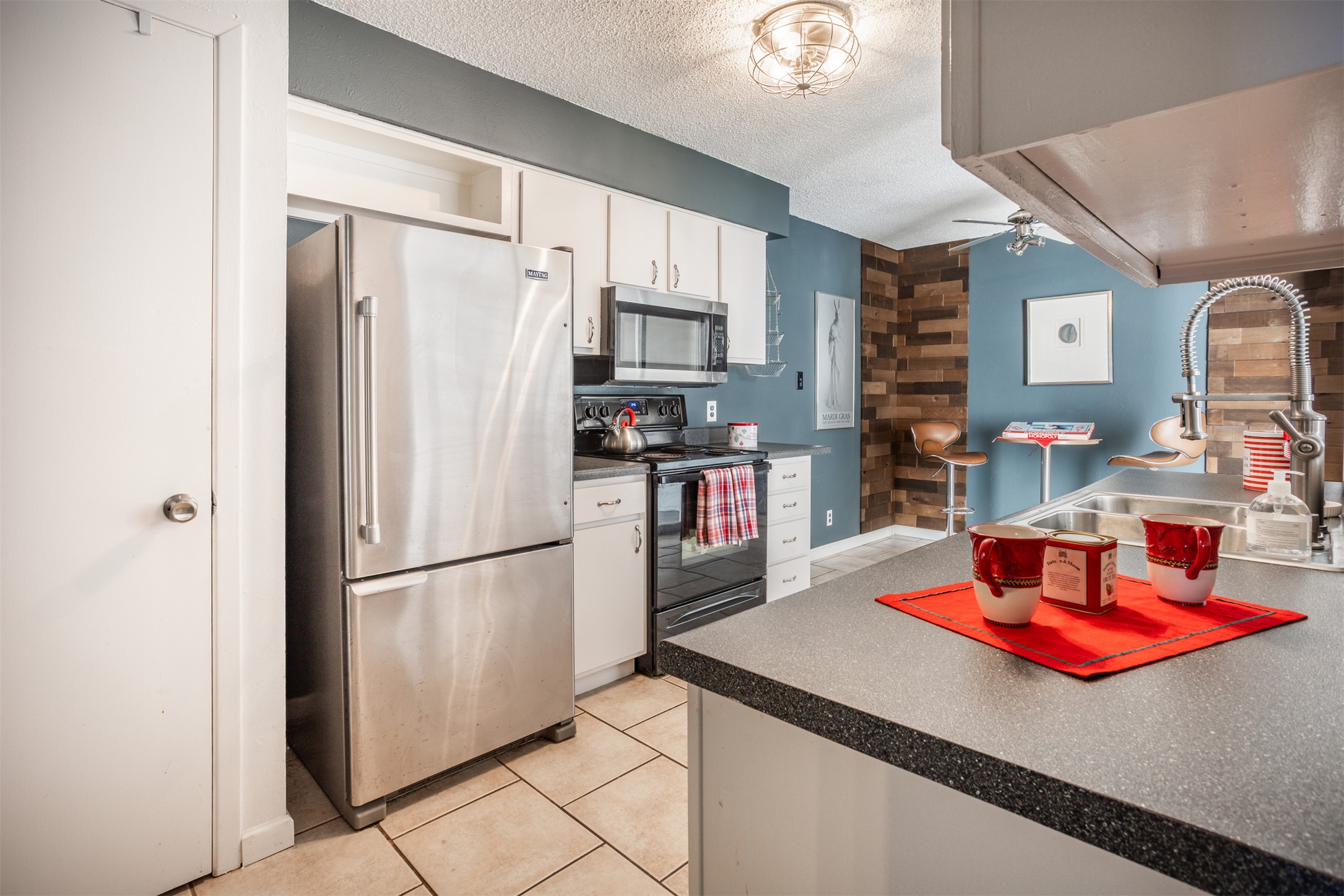 Lovely Kitchen with a bar table and stools for having your morning coffee