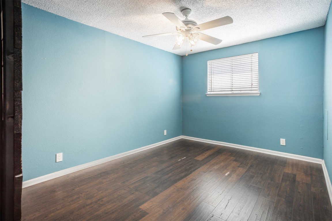 1720 Timber Ridge Drive Austin, TX 78741 - Photo 18 of 30 3rd bedroom with barn door. all bedrooms have extra size closets
