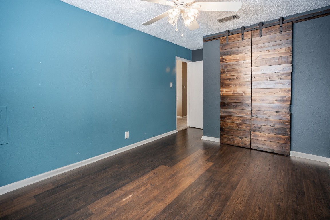 1720 Timber Ridge Drive Austin, TX 78741 - Photo 19 of 30 3rd bedroom with barn doors