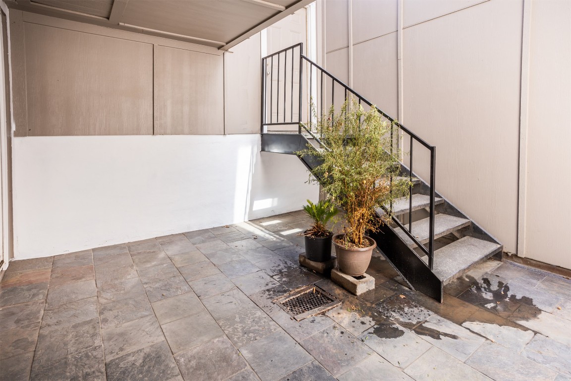 1720 Timber Ridge Drive Austin, TX 78741 - Photo 23 of 30 Courtyard off the Kitchen with stairs to the garage
