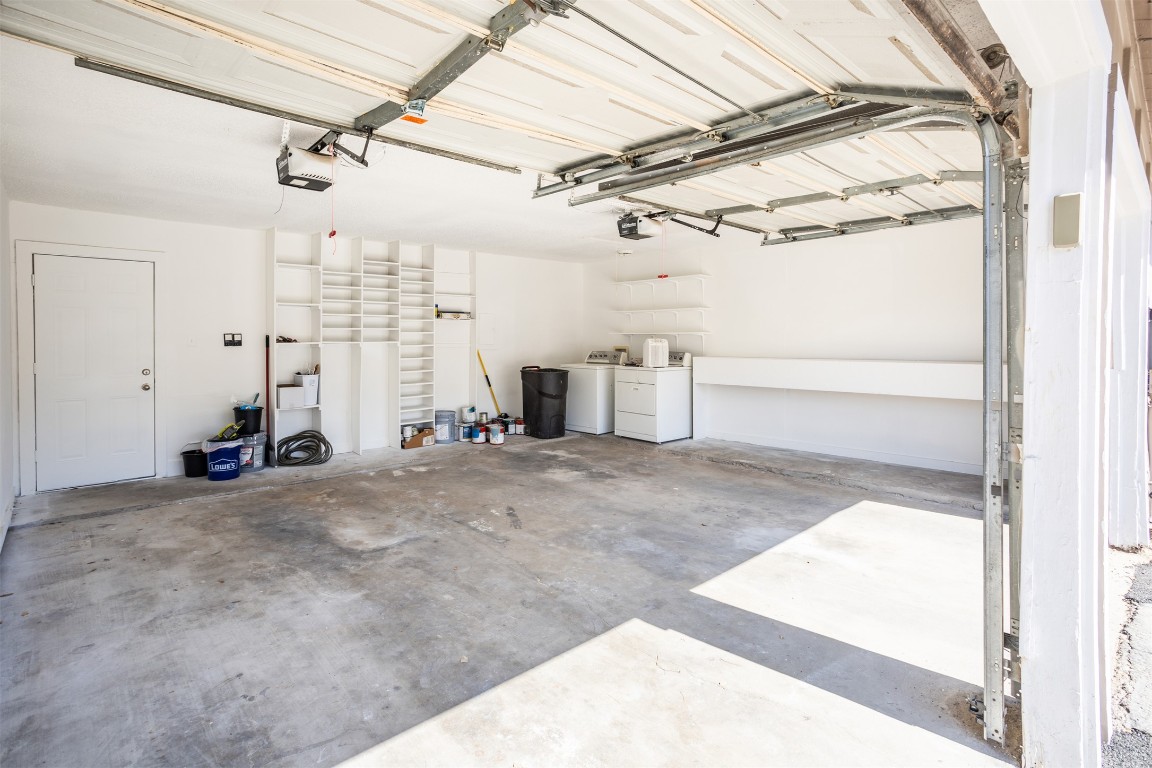 1720 Timber Ridge Drive Austin, TX 78741 - Photo 24 of 30 Big two car garage with the laundry washer and dryer in garage