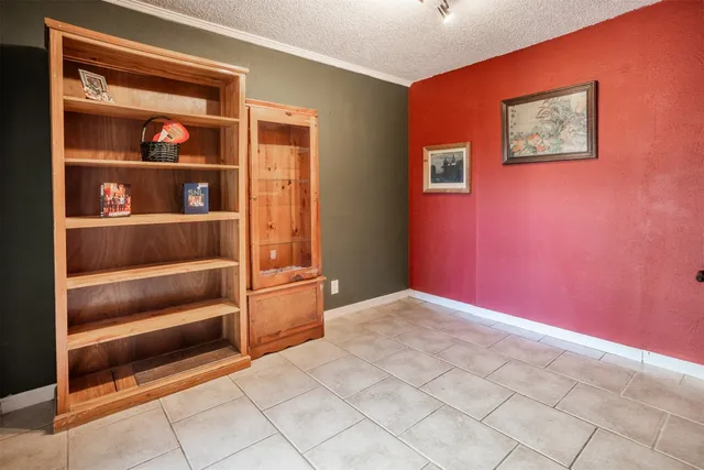a view of a livingroom with shelves