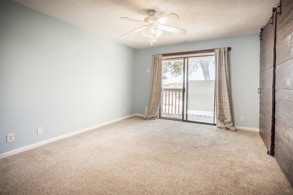1720 Timber Ridge Drive Austin, TX 78741 - Photo 10 of 30 Master bedroom with balconey with view of downtown city skylights