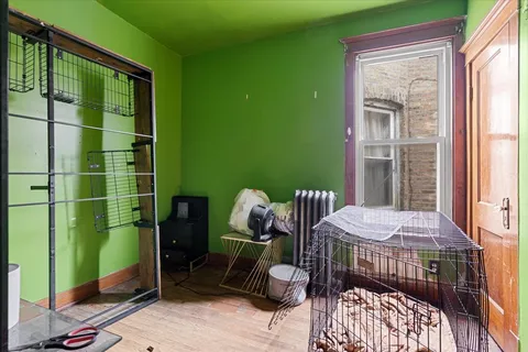 a bedroom with a bed and a mirror
