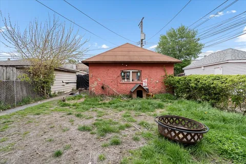 a backyard of a house with a garden
