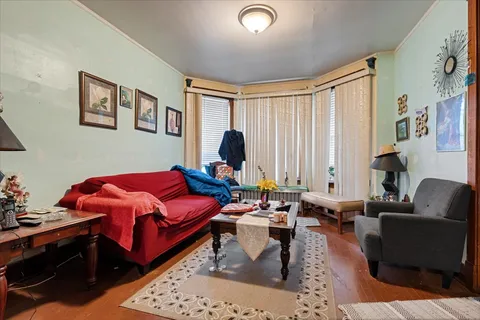 a living room with furniture or couch and a window