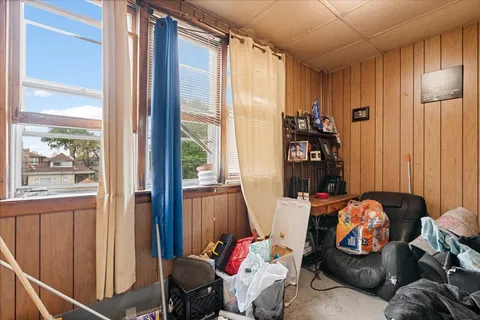 a bedroom with furniture and a window