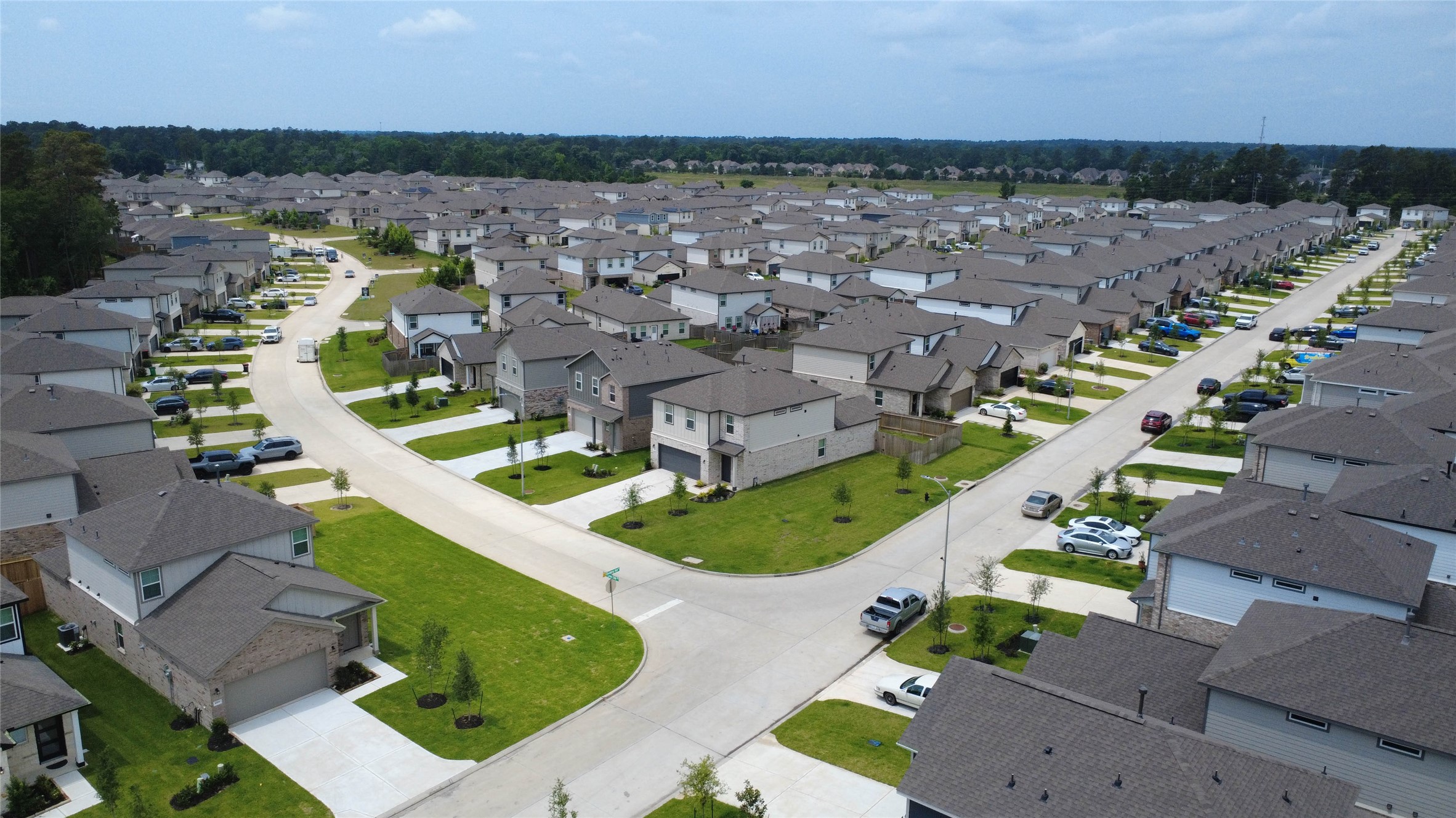 16 Courageous Way Magnolia, TX 77354 - Photo 3 of 19 an aerial view of a house with a garden and lake view