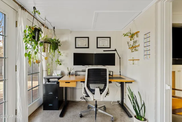 a view of a workspace with furniture