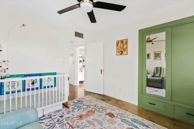 a bedroom with furniture and a window