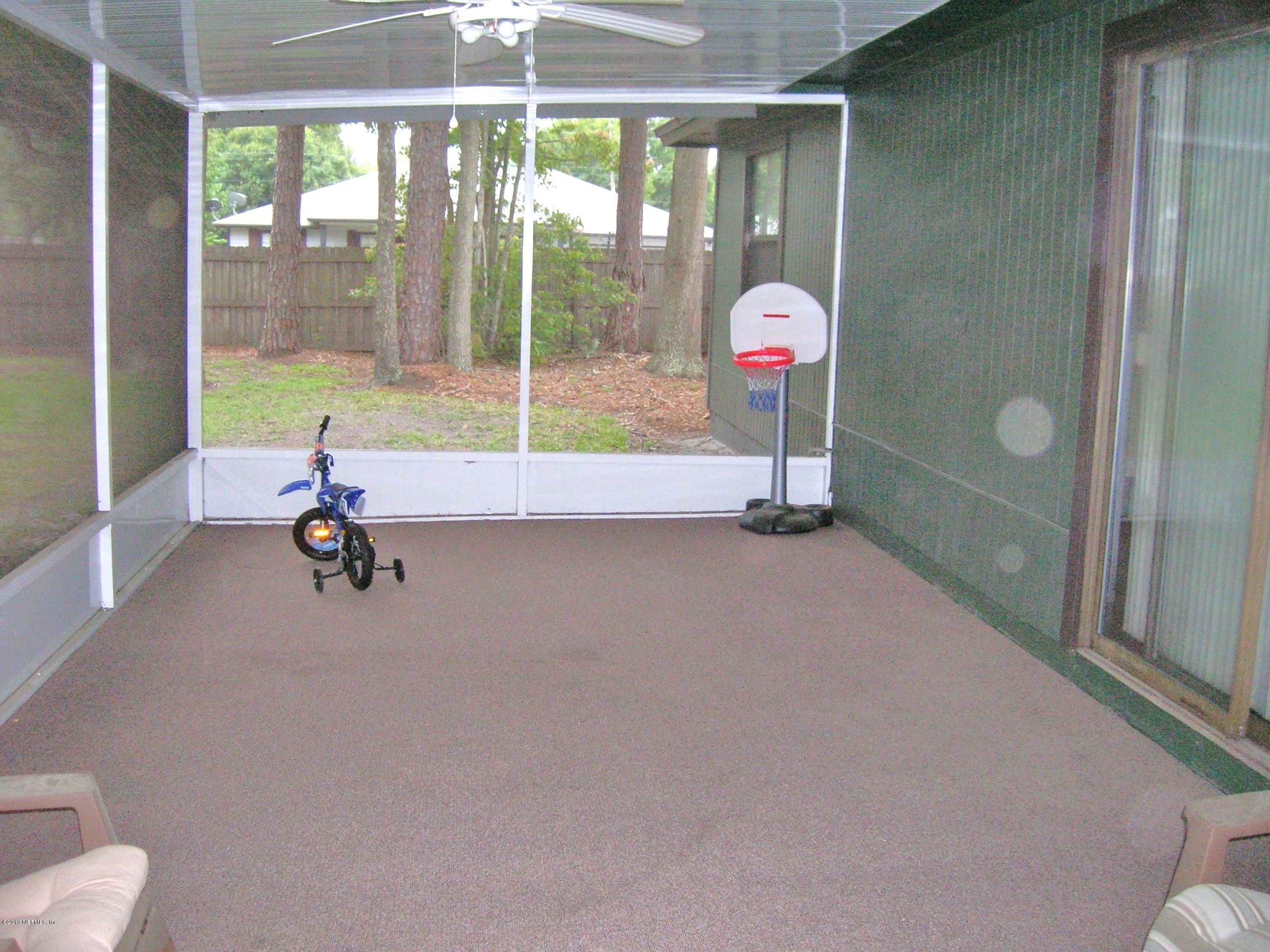 11069 Reading Road Jacksonville, FL 32257 - Photo 12 of 18 a view of a room with gym equipment and windows