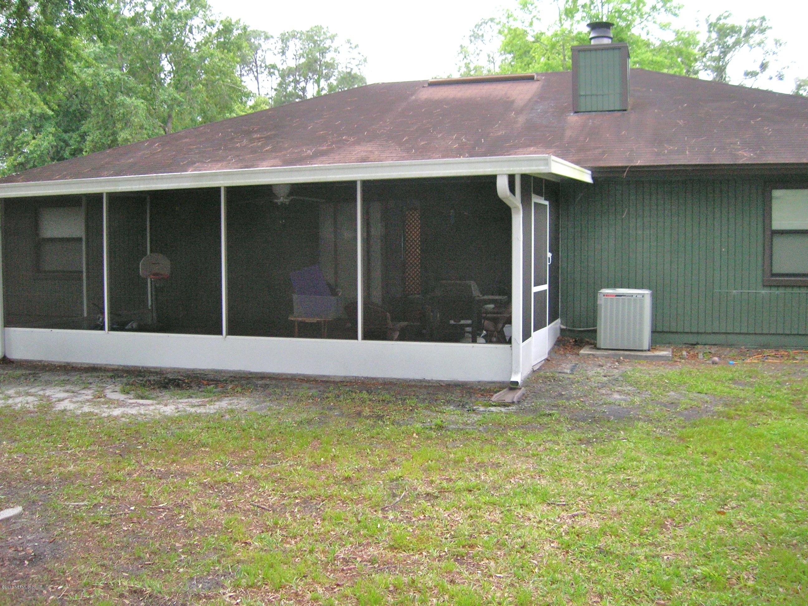 11069 Reading Road Jacksonville, FL 32257 - Photo 13 of 18 a view of a house with a yard