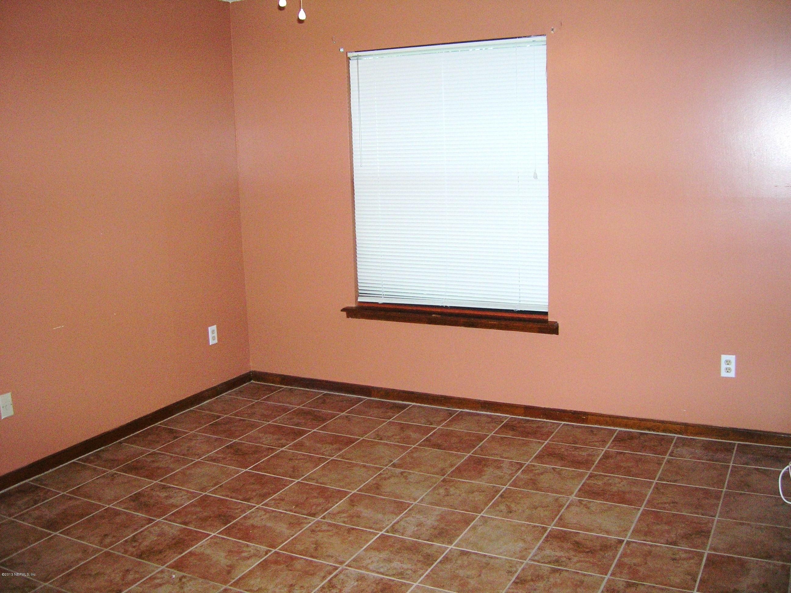 11069 Reading Road Jacksonville, FL 32257 - Photo 16 of 18 an empty room with a window