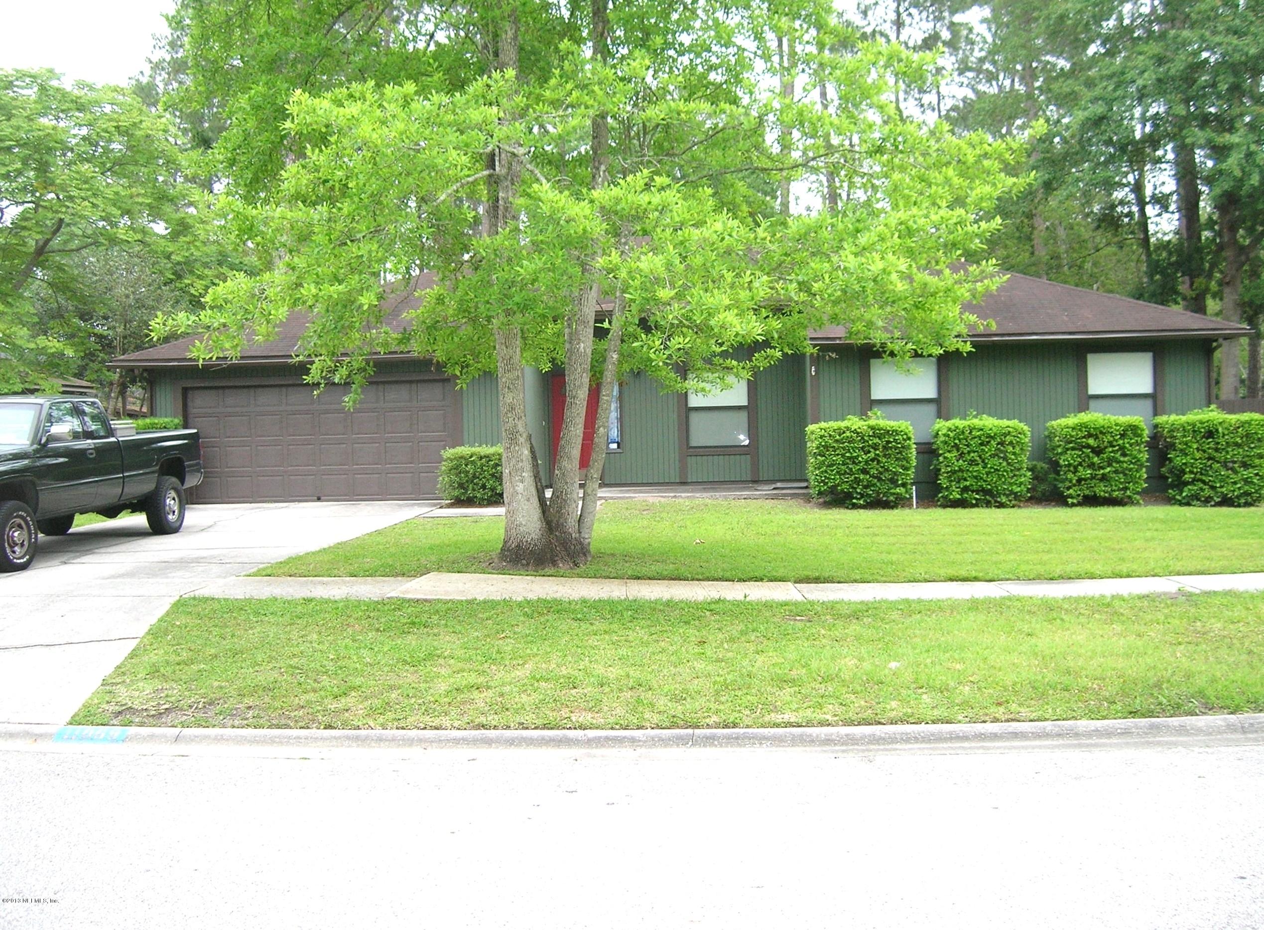 11069 Reading Road Jacksonville, FL 32257 - Photo 2 of 18 a front view of a house with a yard