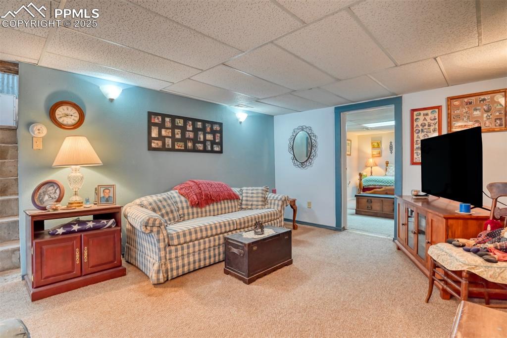 22500 Enoch Road Calhan, CO 80808 - Photo 12 of 29 a living room with furniture and a flat screen tv