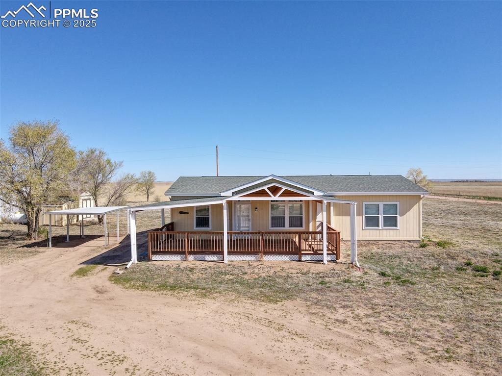 22500 Enoch Road Calhan, CO 80808 - Photo 14 of 29 a front view of a house with a yard