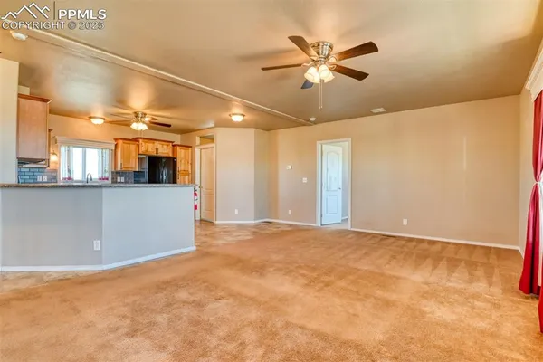a view of a livingroom with a kitchen