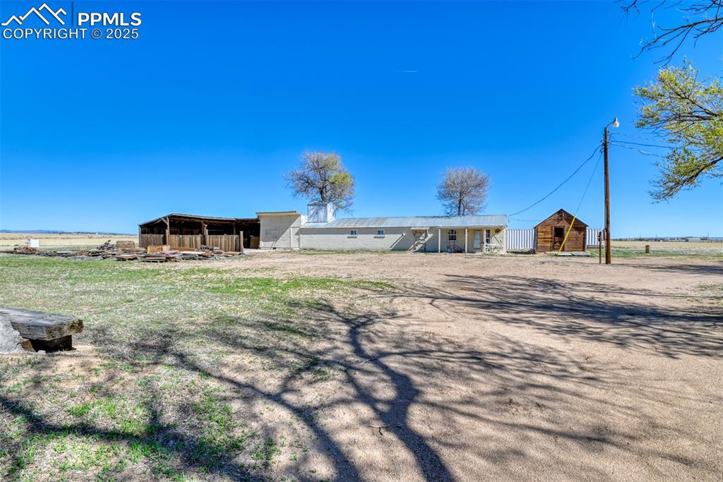 22500 Enoch Road Calhan, CO 80808 - Photo 25 of 29 a front view of a house with a yard