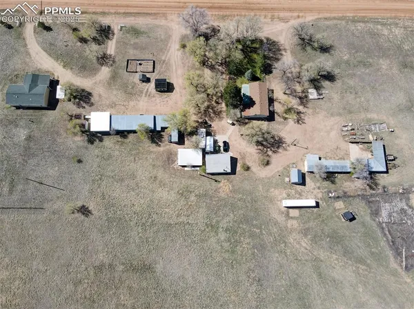 an aerial view of a houses with outdoor space