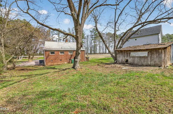 a view of a field with trees