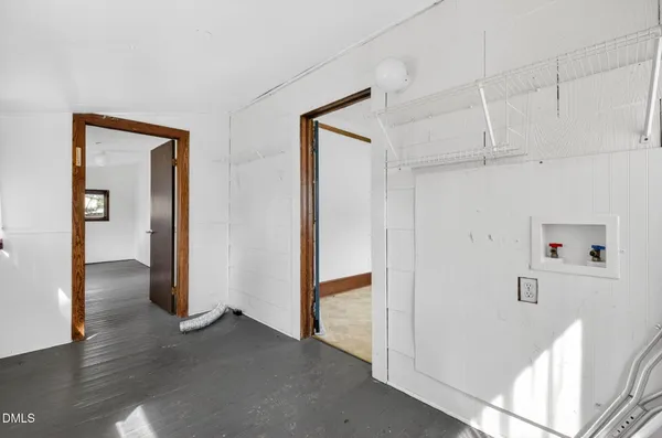 a bathroom with a sink a toilet a mirror and shower